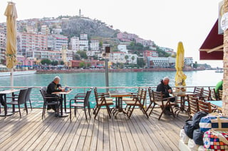 man is sitiing at the terrace in kusadasi